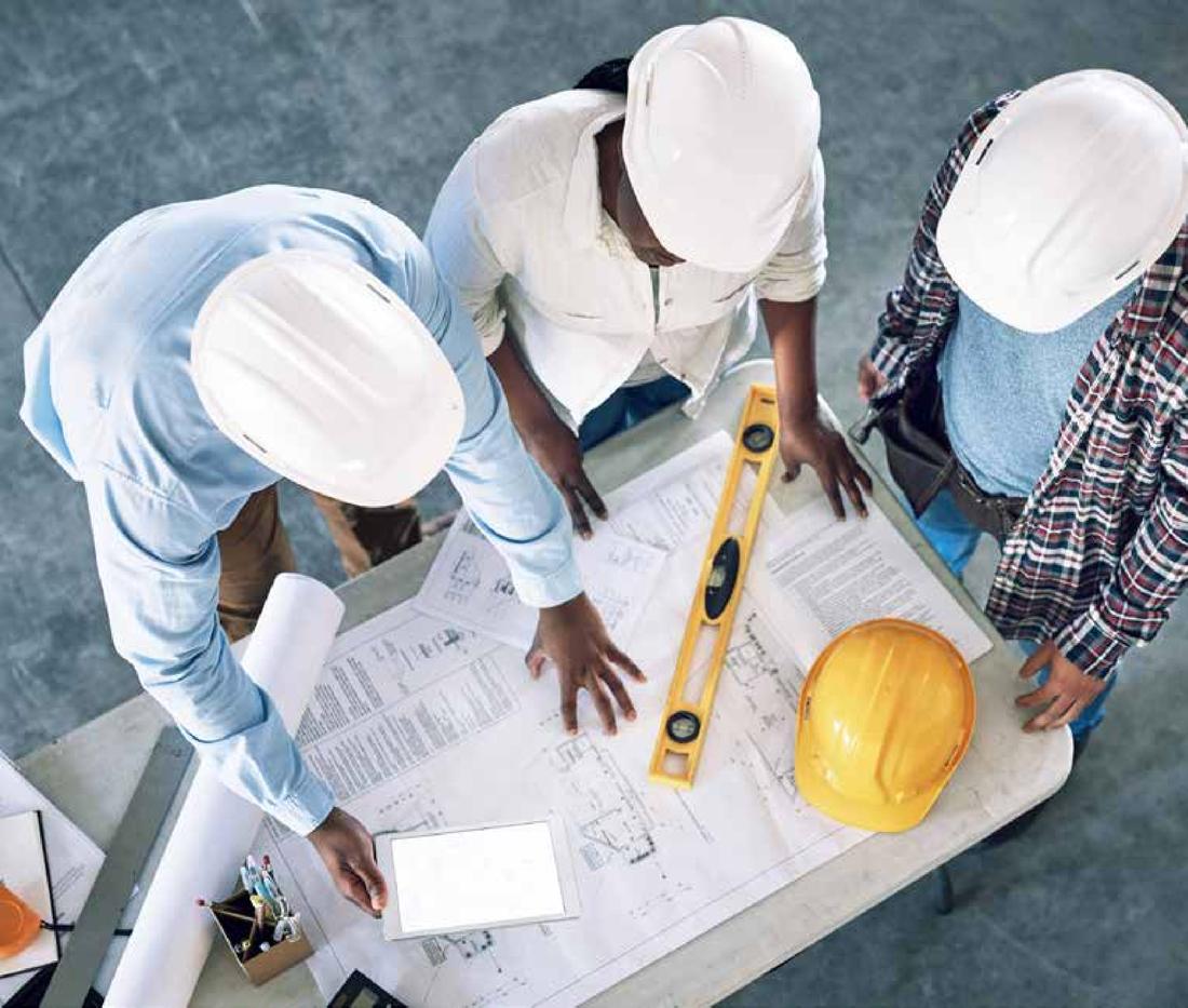 Engineers reviewing drawings on site